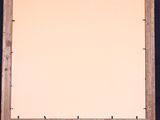 an easel with a blank canvas on it against a blue background
