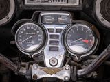 a close up view of a motorcycle dashboard with gauges