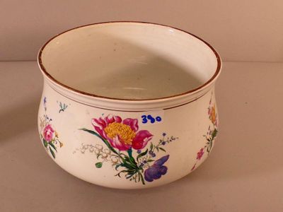 a white bowl with a floral design on it