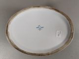 a white plate with a blue design on it