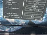 a close up of a sign on the back of a car