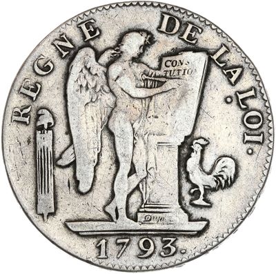 un gros plan d'une pièce d'argent sur laquelle figure un ange