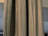 a curtain that is hanging on the side of a window
