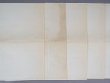 four pieces of paper are taped together on a table