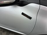 a close up of a car door with a sticker on it