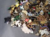 a pile of assorted brooches on a table