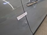 a close up of a car door handle with a sticker on it