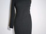 the dress is black and has long sleeves on it