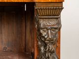 a wooden shelf with a statue on top of it