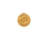 a close up of a gold coin on a white surface