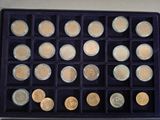a box of coins that are sitting on a table
