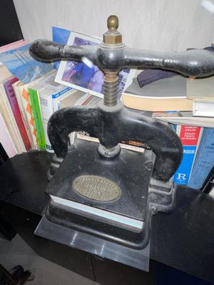 an old phone sitting on top of a table