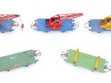 four different types of toy trains on a white surface