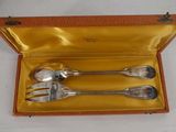 three spoons and a fork in a box