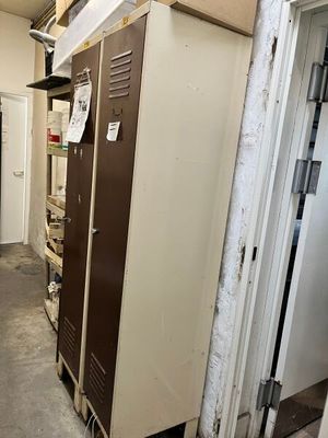 an image of a locker in a room with a door open