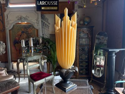 a large vase that is sitting on a table in a room