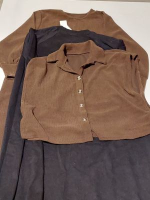 three pieces of clothing are laid out on a white surface