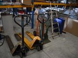 a forklift in the middle of a warehouse with other tools