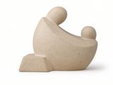a small stone sculpture of a man and a child