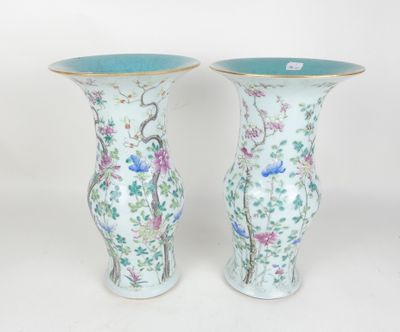 pair of chinese vases with birds and flowers painted on them