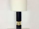 a lamp that is sitting on a table with a lamp on it