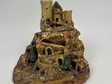 a figurine of a castle on top of a hill