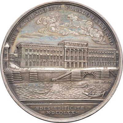 une image représentant une médaille d'argent sur laquelle figure l'image d'un bâtiment
