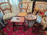 several chairs and a table in a room with a red carpet