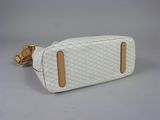 white quilted toiletry bag with tan leather trim
