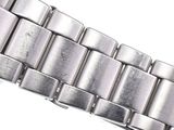 an image of a close up of a watch bracelet on a white surface