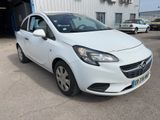 a picture of a white car parked in front of a building