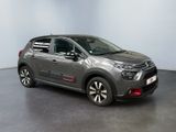 the grey citrole is parked in a large room