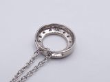 silver ring on a chain with a chain around it