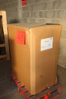 a cardboard box sitting on a pallet in a warehouse