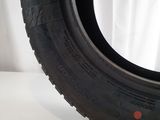 a close up of a tire on a white surface