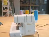 a sewing machine that is sitting on a wooden table
