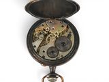 an old pocket watch with a chain attached to it