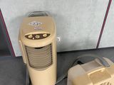 a small air conditioner and a small heater on the floor