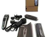 a box with a hair clipper, comb, and other hair accessories