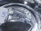a label on the bottom of a glass of water
