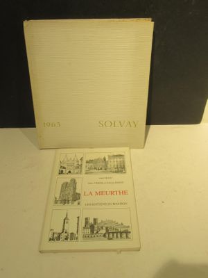 a book that is sitting on a table next to a lamp