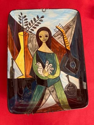 painting of a woman holding a baby on a plate on a red cloth