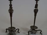 pair of antique brass candlesticks on cast iron bases