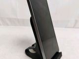a cell phone that is sitting on a stand