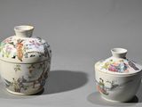 two vases sitting next to each other on a table