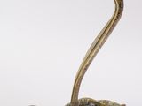 pair of antique brass cobra candlesticks