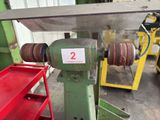 a picture of a machine that is working on a piece of metal