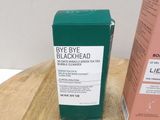 a box of blackhead next to a box of lip balm