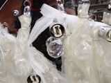 a lot of white dresses hanging on a wire