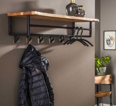 an image of a coat rack with a coat hanging on it